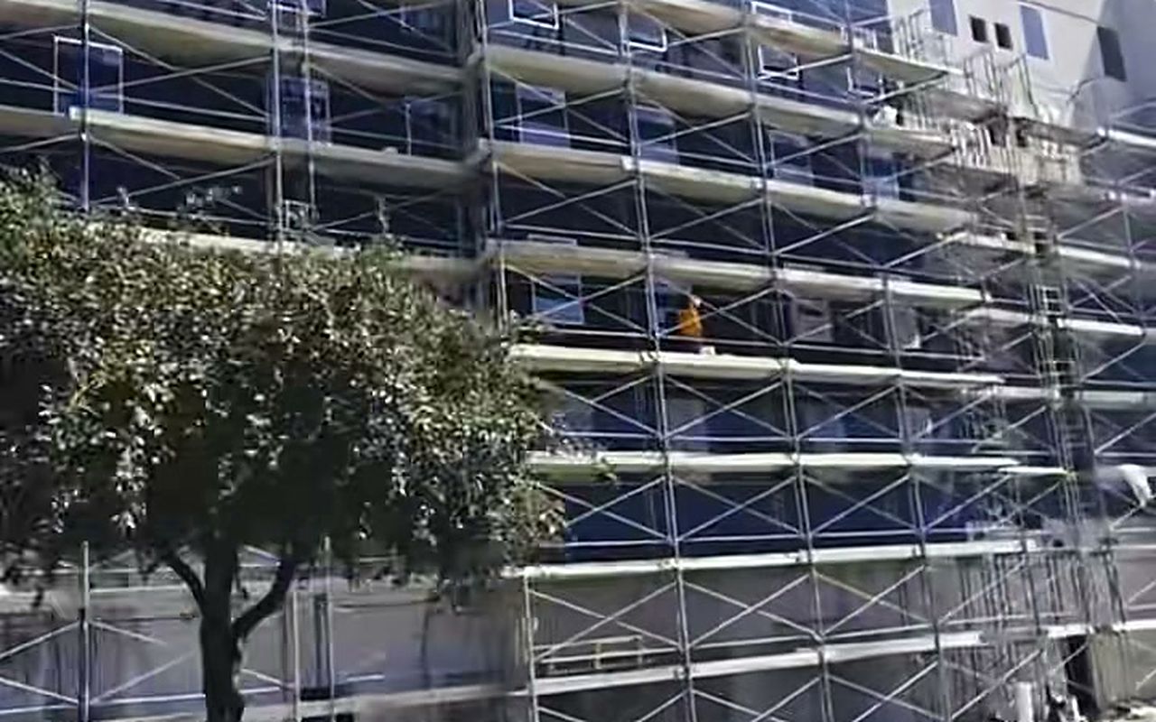 Staybridge Suites in San Antonio wrapped in frame scaffolding by Texas Pro